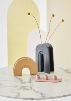 Curved ceramic objects on marble table 