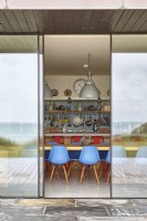 Open door to beach house kitchen 