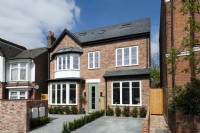 Modern brick house with paved forecourt