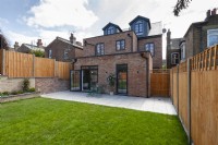 View form garden to the back of a modern brick house