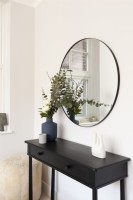 Modern black console table with mirror
