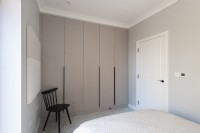 Modern bedroom with built in wardrobes