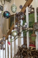 Close up of christmas decorations hanging on staircase bannisters