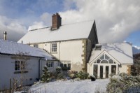 Cottage on Dartmoor with a covering of snow.