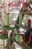Vase and pot collection with wintry berries and christmas decorations