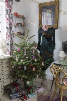Dressing room at christmas, with christmas tree, dressing table and wrapped presents