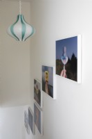 Paintings displayed on white wall