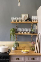 Detail of country style kitchen worktop and shelving