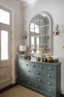 Chest of drawers and mirror in hallway