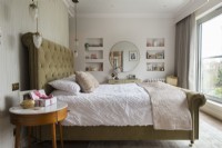 Large upholstered bed in classic style bedroom