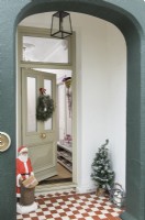 Porch and front door to house decorated for Christmas 