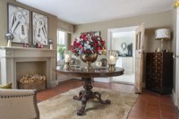 Large floral decoration on classic table in country living room