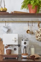 Beautiful kitchen with coffee maker and grinder on modern kitchen worktop