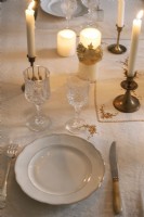 Detail of country dining table laid for Christmas dinner