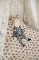 Detail of toy on childs bed