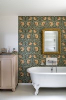 Country bathroom with floral wallpaper feature wall