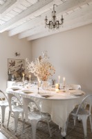 White country dining room - table laid for Christmas