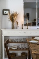 White painted sideboard in country dining room 