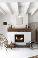 Lit fireplace in country living room