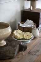 Crockery on wooden sideboard in country kitchen