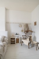 Wooden furniture in a white painted country bedroom