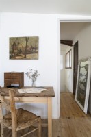 Rustic desk and chair with view to corridor