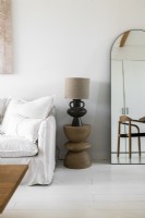 Lamp on wooden side table in modern living room