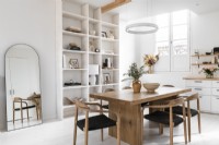 Wooden table and chairs in white painted dining room
