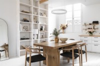 White painted kitchen-diner with wooden furniture