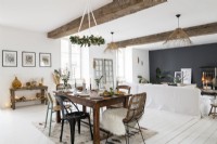 Modern open plan living and dining space decorated for Christmas 