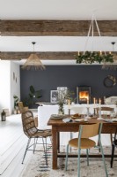 Country open plan living and dining space decorated for Christmas 