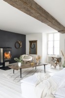 Modern monochrome country living room with lit fire