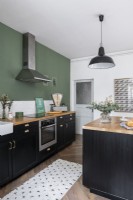 Modern green, black and white kitchen