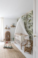 Tropical wall paper in baby nursery
