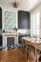 Fireplace and parquet flooring in kitchen-diner with period details