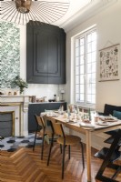 Parquet flooring and period  details in modern kitchen-diner