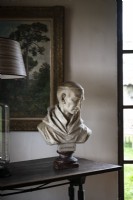 Detail of classic bust on wooden table