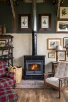 Lit wooden burning stove in country living room