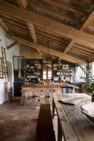 Rustic wooden table in country kitchen-diner