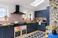 Blue and pink kitchen with black,white and oak vinyl floor tiles