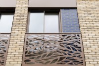 Detail of modern apartment building window with metal cut out Juliet balcony