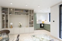 Built in shelving in open plan living space with kitchen