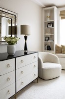 Modern bedroom details decorated in white, cream, black and gold colours.