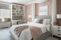 Feminine childrens bedroom in pink, white and grey.