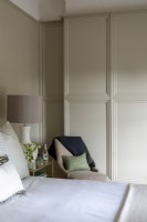 Comfortable bedroom with panelled walls