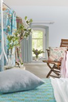 Pale blue bedroom in country house 