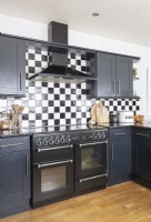 Range style cooker in modern black and white kitchen