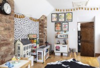 Childrens room with play kitchen and large cowhide rug