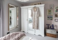 Glamorous dress hanging on wardrobe in vintage bedroom