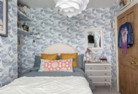 Wave patterned wallpaper in vintage bedroom